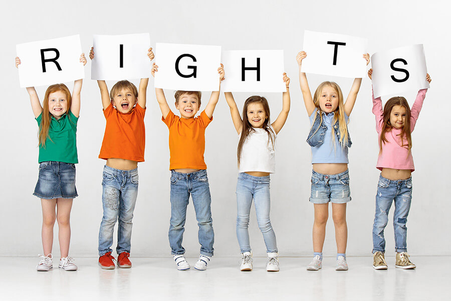 children holding up individual letters spelling the work 'rights'
